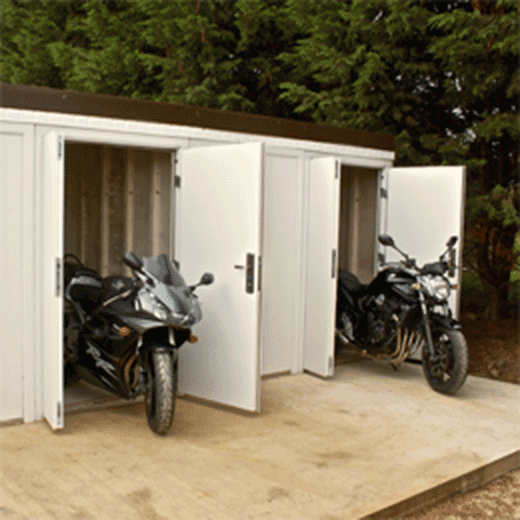 Ministor concrete sheds shown with two motorbikes